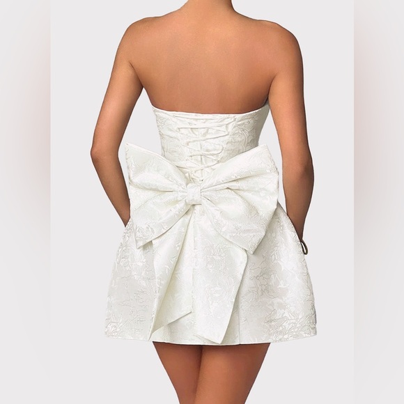 Textured Sleeveless Dress With Metal Embellished Bows - White